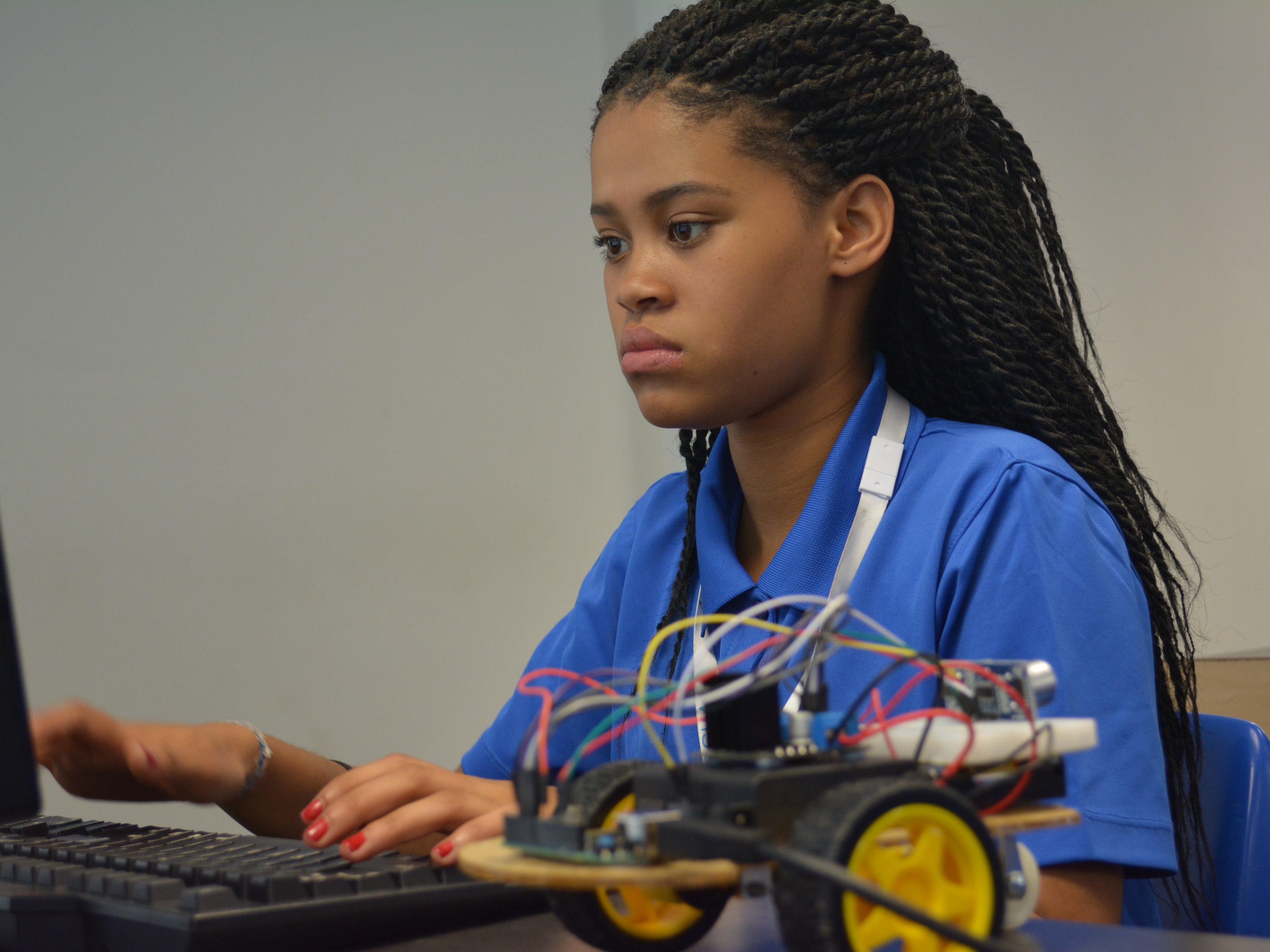 student programming a robot